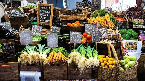 Fresh produce and vendors at a farmers market