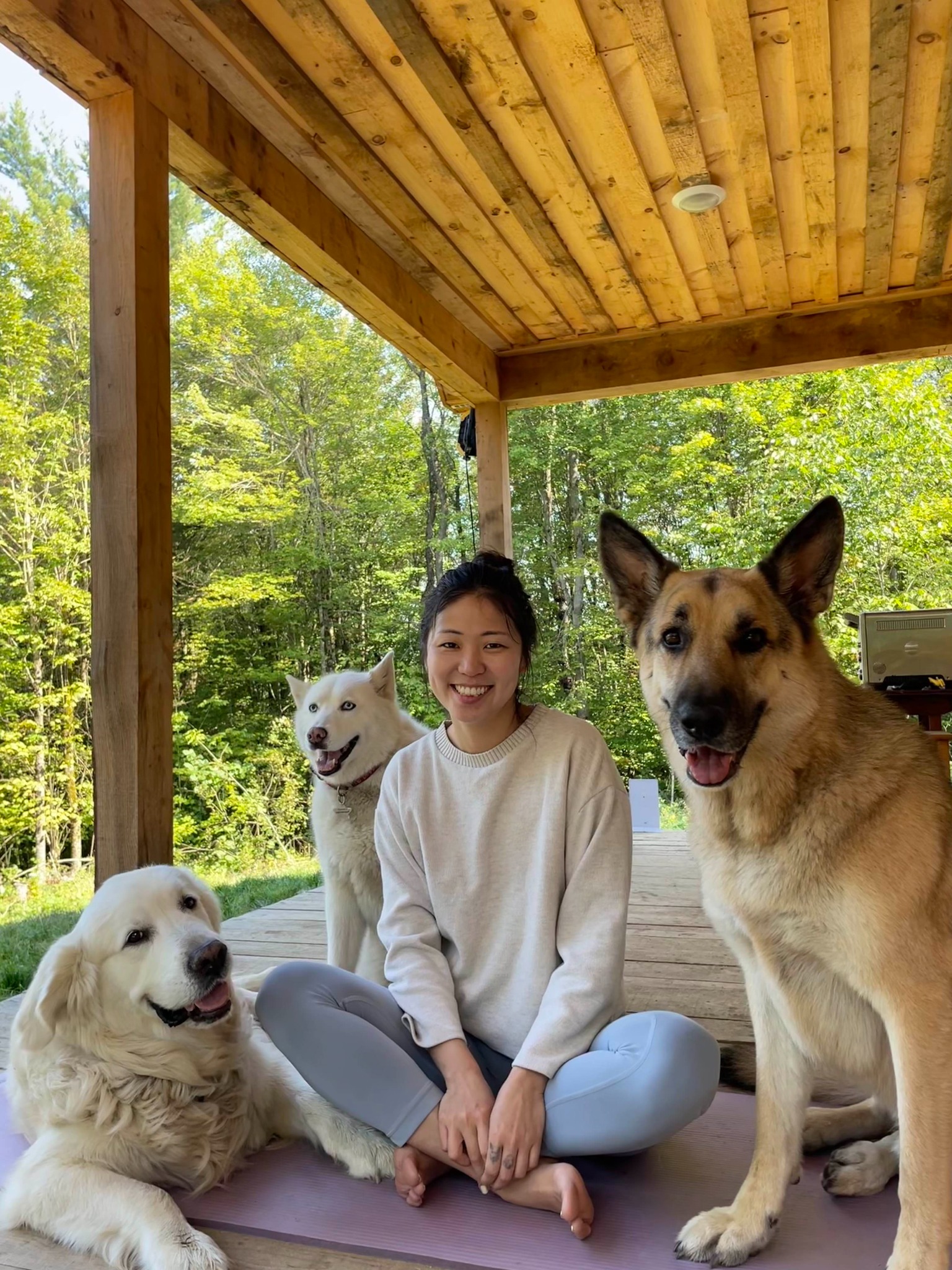 Wenxin Ye outdoors with her dogs