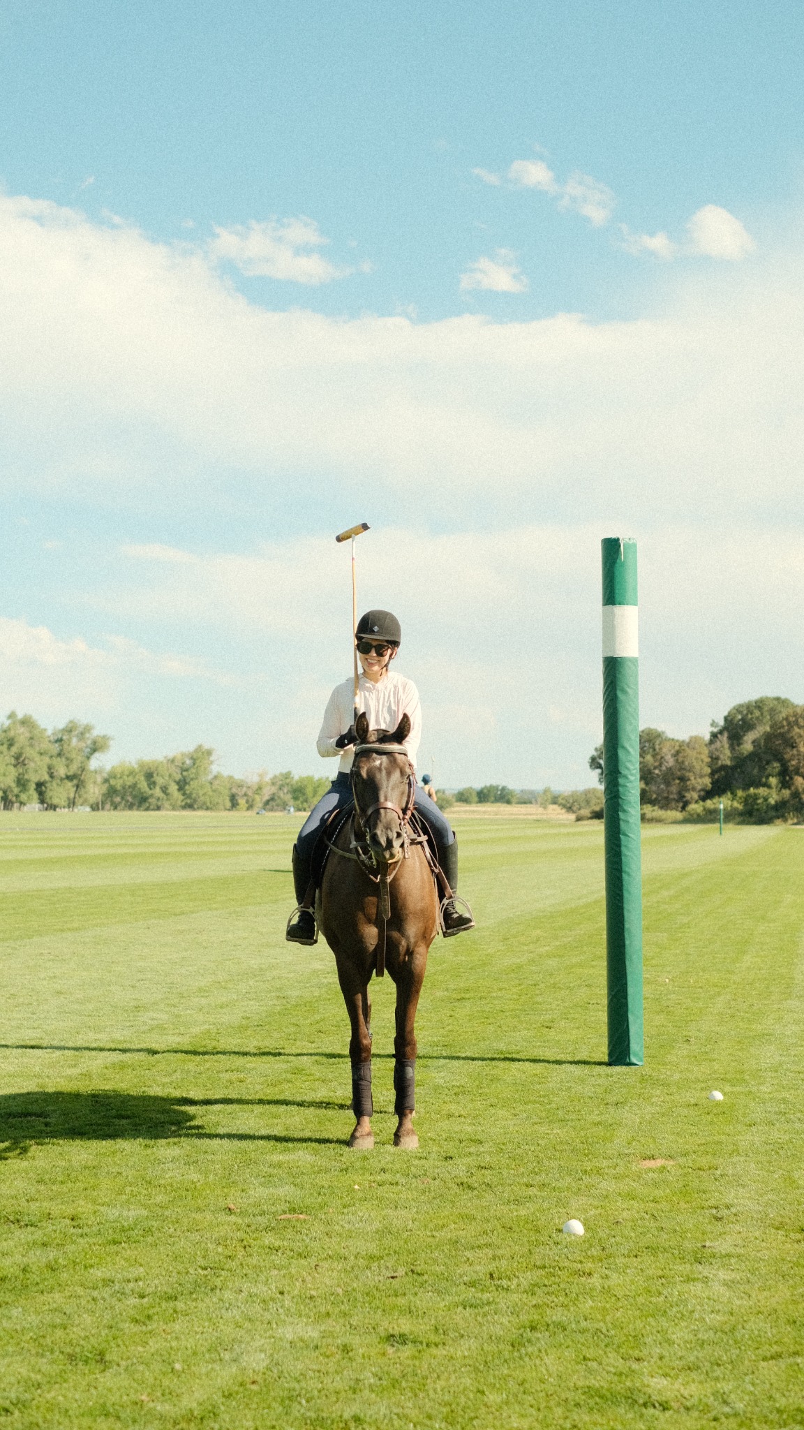 Wenxin on horseback on the field